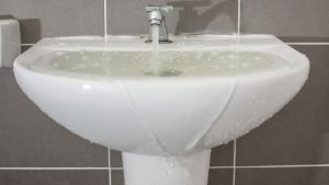 Sink overflowing with water